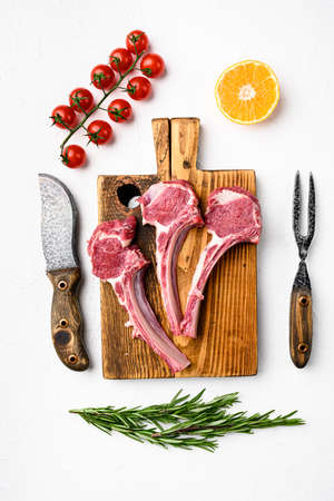 Uncooked mutton rack of lamb set, on white stone table background, top view flat layの写真素材