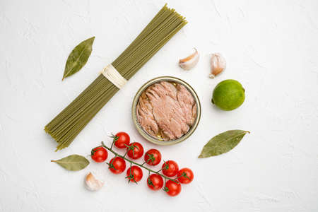 Pasta with tuna raw ingredients set, on white stone table background, top view flat layの写真素材