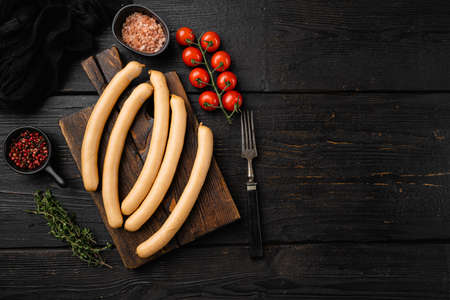 Fresh boiled Wiener sausages set, on black wooden table background, top view flat lay, with copy space for textの写真素材