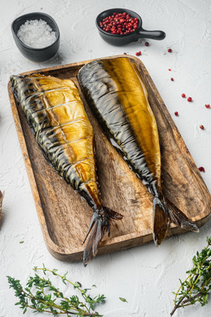 Appetizing smoked fish mackerel, on white backgroundの写真素材