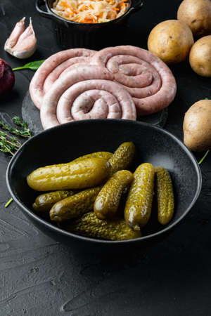 Fermented vegetables Pickled gherkins cucumbers set, on black backgroundの写真素材