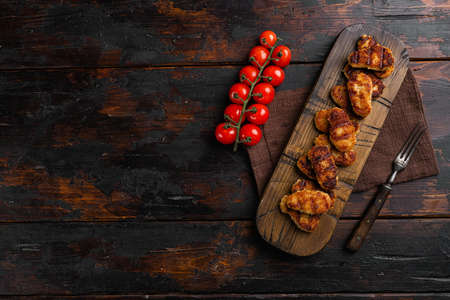 Tasty fried chicken nuggets set, on old dark wooden table background, top view flat lay, with copy space for textの写真素材
