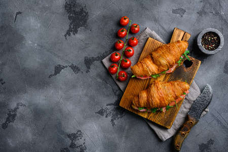 Croissant sandwich with salmon set, on gray stone table background, top view flat lay, with copy space for textの写真素材