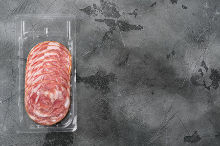 Dry smoked sausage pack set, on gray stone table background, top view flat lay, with copy space for...