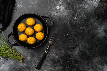 Battered meat, on black dark stone table background, top view flat lay, with copy space for text