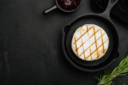 Grilled goat cheese, on black dark stone table background, top view flat lay, with copy space for textの写真素材