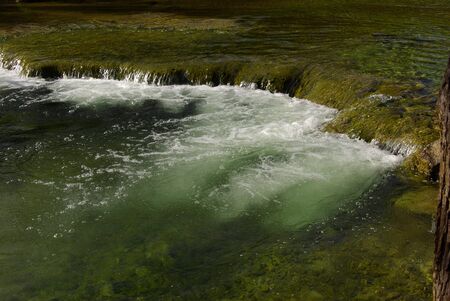 small fall in clear streamの写真素材