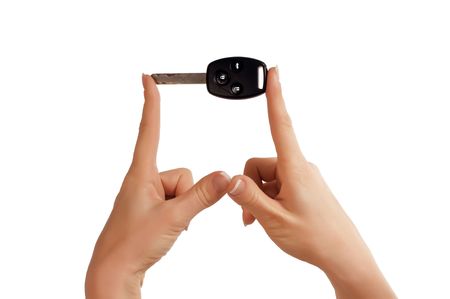hand with black car key as symbol of successの写真素材