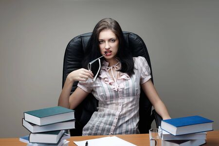 secretary  sit at the table in an armchairの写真素材