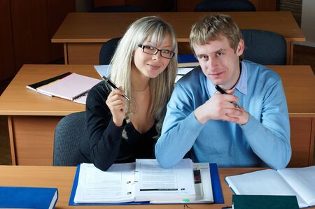young students girl and boy in classroomの写真素材
