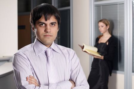 young businessman with collegue in officeの写真素材