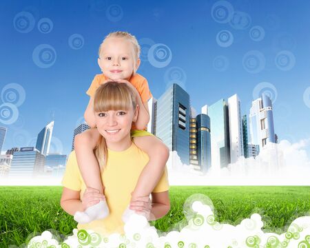 Collage with children and parents on green grass and under blue skyの写真素材