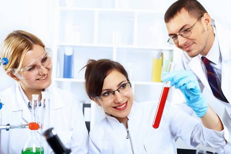Scientist in uniform doing tests in laboratoryの写真素材