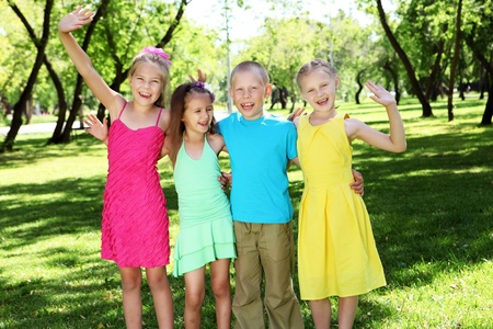 Happy active children playing in the summer parkの写真素材