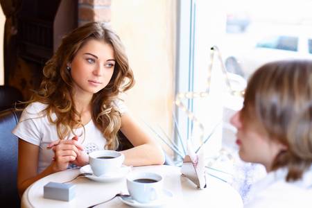 Young couple in love having a date in restaurantの写真素材