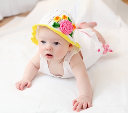 portrait of cute little baby in a funny hatの写真素材