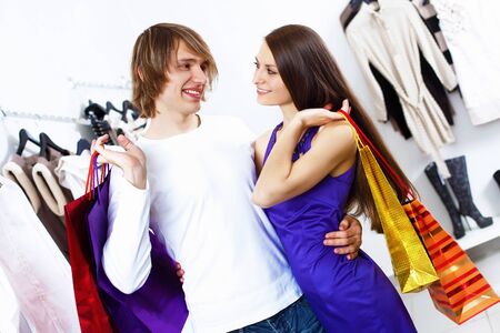 Young caucausian couple doing clothing shopping togetherの写真素材