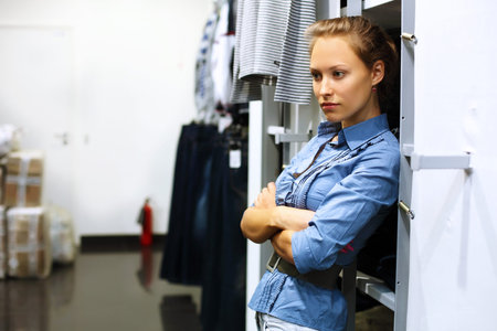 Young girl in a shop buying clothes