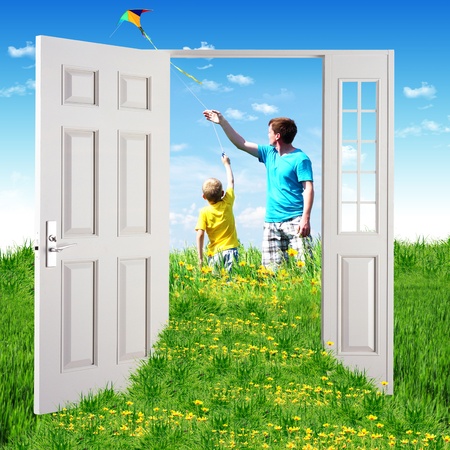 Picture of a open door leading to summer landscapeの写真素材