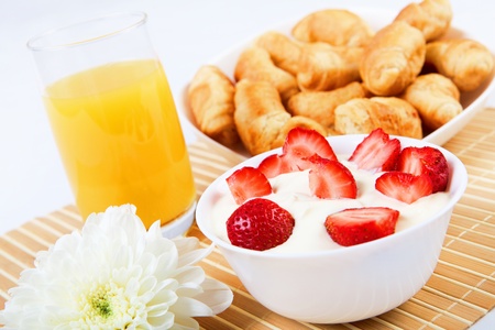 Early breakfast. Strawberries, cream and juice. The symbol of healthy lifestyles.の写真素材
