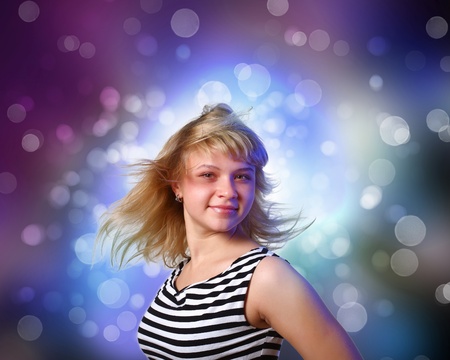 Image of young woman and colorful disco backgroundの写真素材