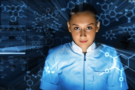 Young chemist in white uniform working in laboratory