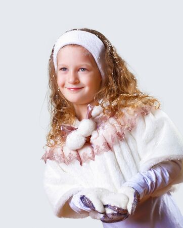 Cuty little girl in winter wear happy about new yearの写真素材