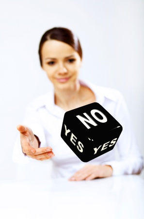 Image of a flying dice as symbol of risk and luckの写真素材