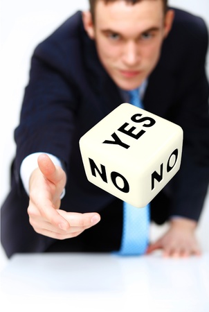 Image of a flying dice as symbol of risk and luckの写真素材
