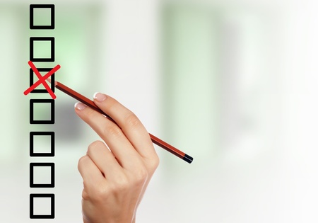 Image of a check list with red markの写真素材