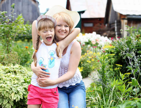 Mother and daughter engaged in gardening togetherの写真素材