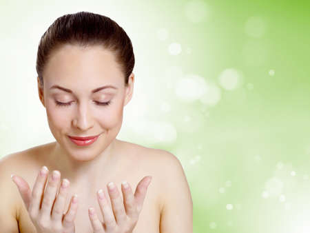 Studio portrait of young beautiful woman natural lookの写真素材