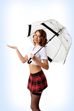 Young prestty woman dressed in retro style with umbrellaの写真素材