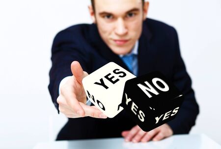 Image of a flying dice as symbol of risk and luckの写真素材