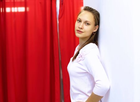 Young woman doing shopping in clothes storeの写真素材