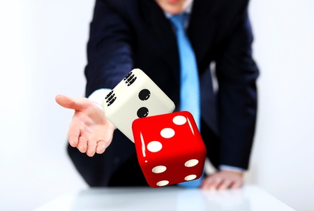 Image of a flying dice as symbol of risk and luckの写真素材