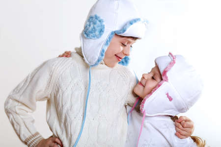 Portrait of little kid in winter wear against white backgroundの写真素材