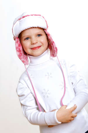 Portrait of little kid in winter wear against white backgroundの写真素材