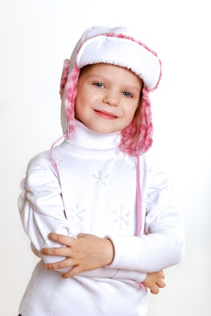 Portrait of little kid in winter wear against white backgroundの写真素材