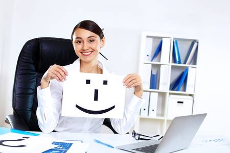 Portrait of young woman in business wear in officeの写真素材