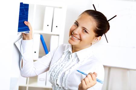 POrtrait of a young beautiful woman in business wear at workの写真素材