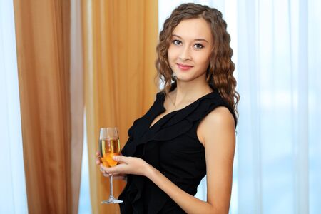 Portrait of a young pretty woman sitting in restaurantの写真素材