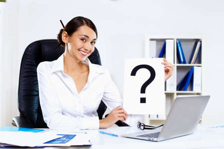 Portrait of young woman in business wear in officeの写真素材