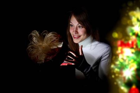 Collage of a young woman reading a magic bookの写真素材