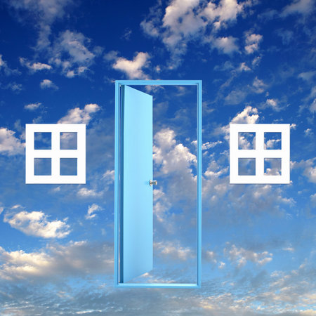 Picture of a white door against blue sky backgroundの写真素材