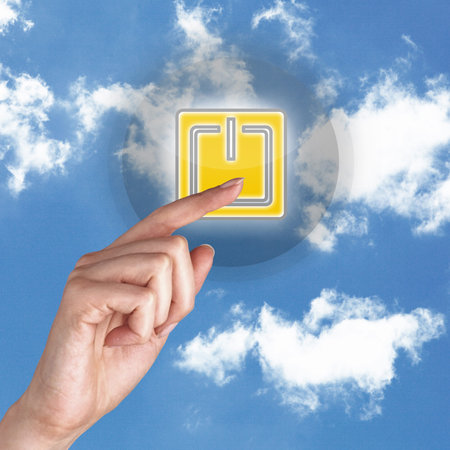 Picture of power button against blue sky backgroundの写真素材