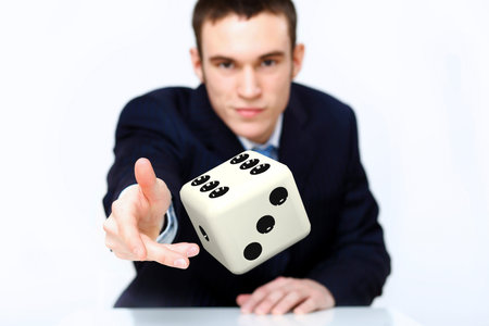 Image of a flying dice as symbol of risk and luck