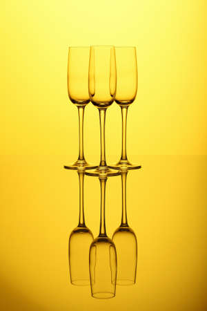Glasses with wine on the color backgroundの写真素材