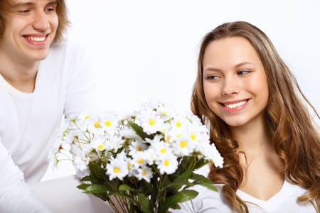 Portrait of young happy couple at homeの写真素材