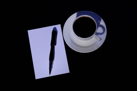 White cup with black coffee at business workplaceの写真素材
